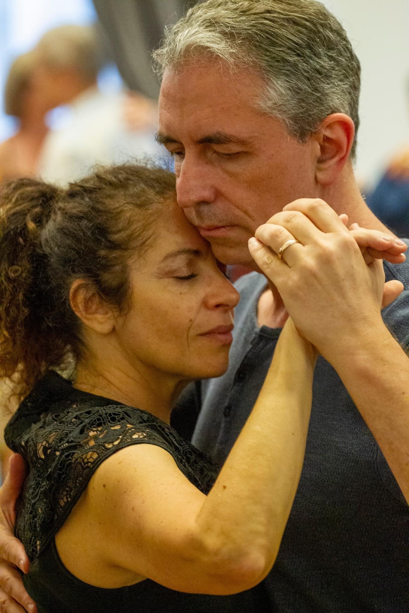Couple dancing elegantly in a ballroom