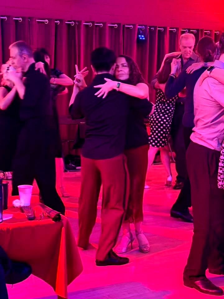 Dancers on the floor at a vibrant milonga