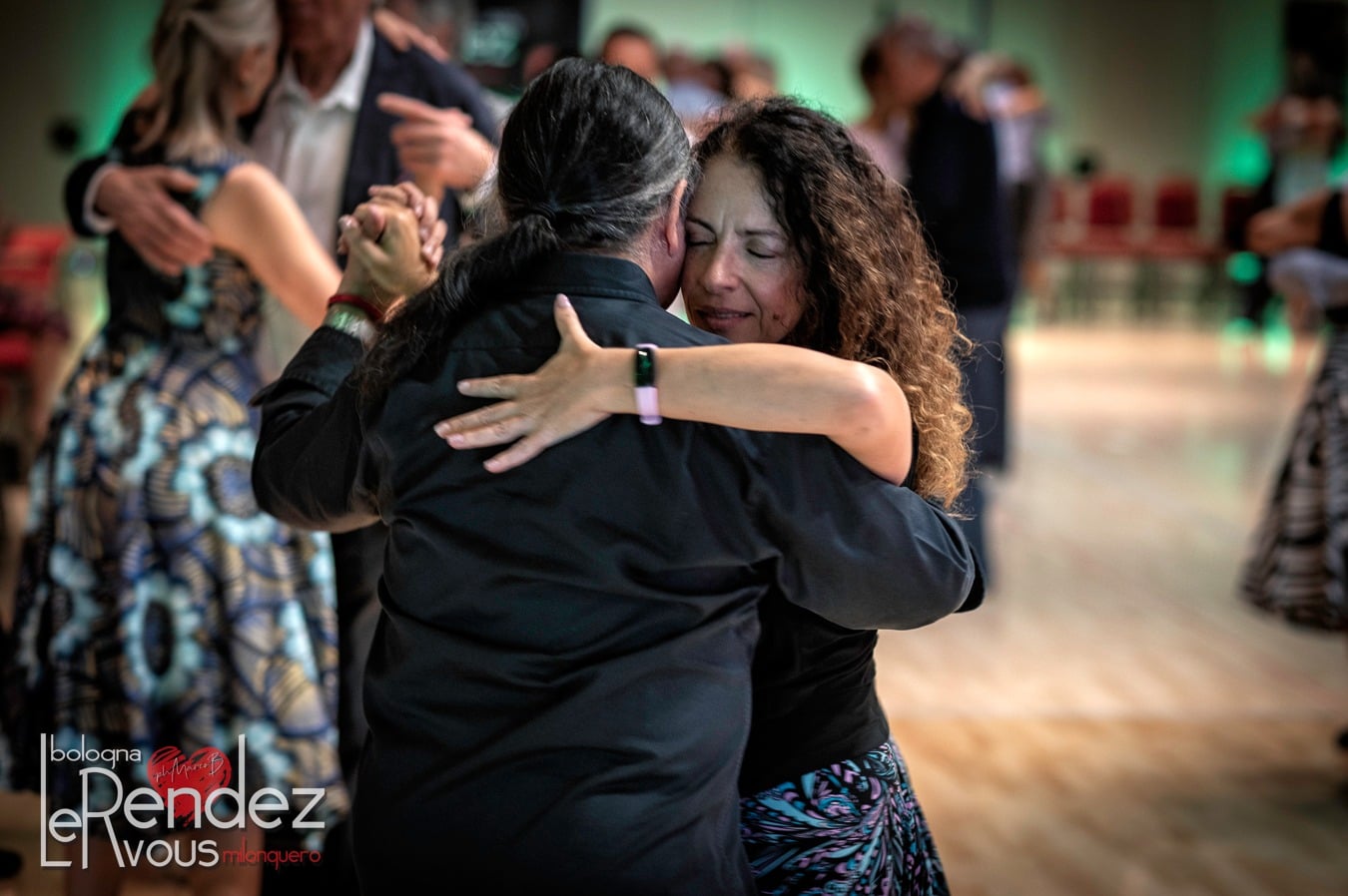 Couple dancing elegantly in a ballroom